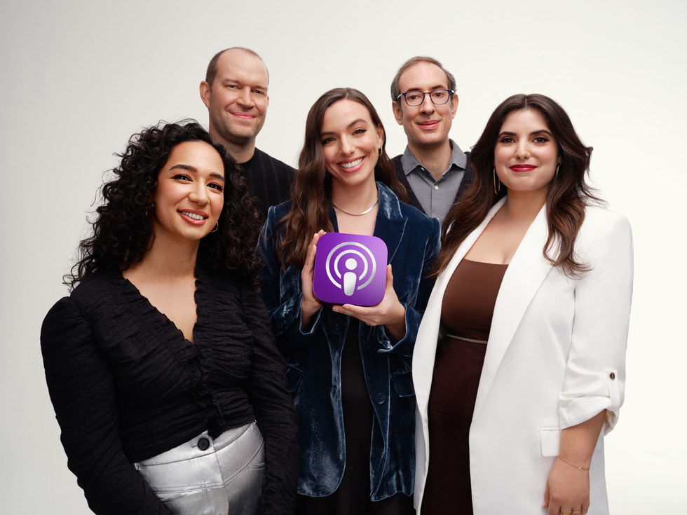 The Slate team for Slow Burn’s latest season, Roe v. Wade, holding the Apple Podcasts Award honoring a “Show of the Year.”