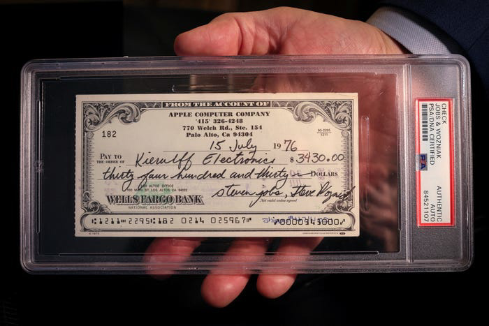 A 1976 Apple Computer check signed by founders Steve Jobs and Steve Wozniak is displayed during a preview of items offered in RR Auction's "The Steve Jobs Revolution" sale, in New York City, U.S. March 8, 2022.